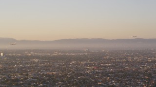 DCLA_203 - 5K aerial stock footage track two airliners approaching Los Angeles International Airport, California