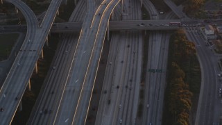 DCLA_205 - 5K stock footage video of freeway interchange between I-110 and 105 in Westmont at sunset, California