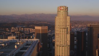 DCLA_213 - 5K aerial stock footage tilt from Hope Street to approach Aon Center and US Bank Tower at sunset in Downtown Los Angeles, California
