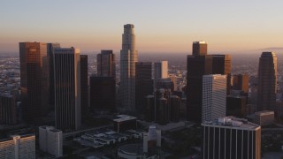 DCLA_217 - 5K aerial stock footage tilt to reveal and approach Downtown Los Angeles and Bonaventure Hotel at sunset, California