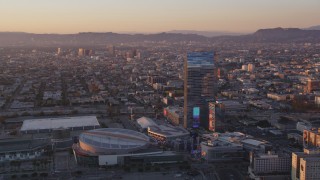 DCLA_224 - 5K aerial stock footage of Staples Center and Ritz-Carlton Hotel in Downtown Los Angeles at sunset, California