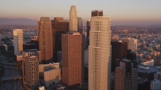 DCLA_227 - 5K aerial stock footage tilt from heavy traffic on Highway 110 to reveal and approach Downtown Los Angeles at sunset, California
