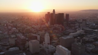 DCLA_231 - 5K aerial stock footage fly away from city hall at sunset to reveal Downtown Los Angeles skyline, California