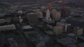 DCLA_240 - 5K aerial stock footage flyby Deloitte & Touche toward city hall in Downtown Los Angeles at twilight, California