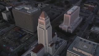 DCLA_241 - 5K aerial stock footage orbit Los Angeles City Hall at twilight in Downtown Los Angeles, California
