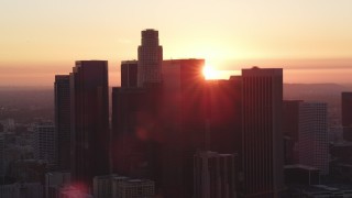 DCLA_243 - 5K aerial stock footage of Downtown Los Angeles skyline silhouetted by the setting sun, California