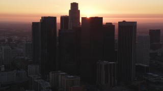 DCLA_244 - 5K aerial stock footage of Downtown Los Angeles skyline with sunset in background, California