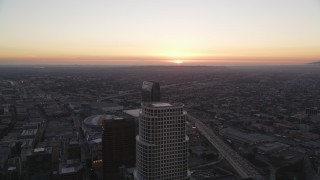 DCLA_253 - 5K aerial stock footage fly over Downtown Los Angeles toward setting sun in California