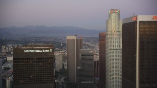 DCLA_263 - 5K aerial stock footage fly between skyscrapers to approach US Bank Tower at twilight in Downtown Los Angeles, California