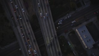 DCLA_270 - 5K aerial stock footage bird's eye view of light traffic on Highway 101 in Hollywood at twilight, California