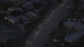 DCLA_272 - 5K aerial stock footage bird's eye of heavy traffic on Highway 101 at twilight in Hollywood, California