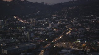 DCLA_273 - 5K aerial stock footage tilt along Highway 101 with heavy traffic Hollywood, California, twilight