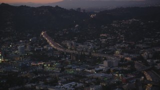 DCLA_274 - 5K aerial stock footage of heavy traffic on Highway 101 by Hollywood at twilight, California