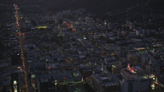 DCLA_275 - 5K aerial stock footage approach Hollywood with bright lights on city streets at twilight, California