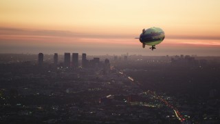 DCLA_278 - 5K aerial stock footage video of approaching a blimp near Century City skyscrapers at twilight, California