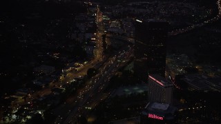 DCLA_286 - 5K aerial stock footage of light Highway 101 traffic in Universal City at night, California