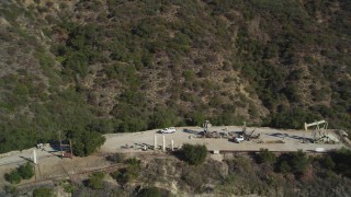 DCSF01_003 - 5K aerial stock footage Orbiting oil rigs in the hills, Santa Paula, California