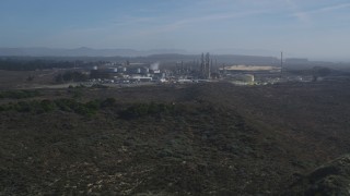 DCSF02_004 - 5K aerial stock footage Tilt from Pismo Dunes, reveal Phillips 66 Company Santa Maria Refinery, Arroyo Grande, California