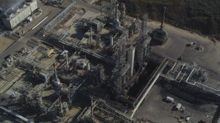 DCSF02_007 - 5K aerial stock footage Tilt to bird's eye of flare stacks and structures at Phillips 66 Company Santa Maria Refinery, Arroyo Grande, California