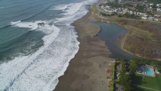 DCSF03_013 - 5K aerial stock footage Tilt from Moon Stone Beach to reveal homes on the coast, Cambria, California
