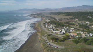DCSF03_014 - 5K aerial stock footage Approaching a coastal residential neighborhood, Cambria, California
