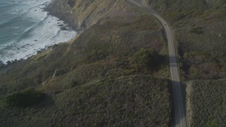 DCSF03_037 - 5K stock footage aerial video Tilt from bird's eye of Highway 1 above the coastline, Big Sur, California