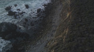 DCSF03_042 - 5K aerial stock footage Bird's eye view of waves slamming into coastal rock formations, Big Sur, California