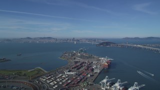 DCSF05_005 - 5K aerial stock footage Fly over the Port of Oakland to approach the Bay Bridge and San Francisco Bay, California