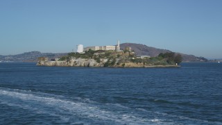 DCSF05_023 - 5K aerial stock footage Orbit a ferry sailing the bay and reveal Alcatraz, San Francisco, California