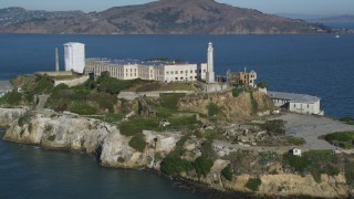 DCSF05_025 - 5K aerial stock footage Approach and flyby the main building and lighthouse of Alcatraz, San Francisco, California