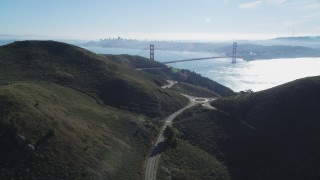 DCSF05_047 - 5K stock footage aerial video Flyby the Marin Headlands, eclipsing Golden Gate Bridge, San Francisco skyline in background, Marin County, California