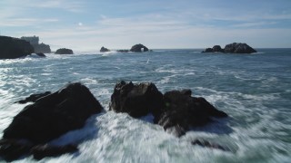 DCSF05_051 - 5K stock footage aerial video Tilt from the Pacific Ocean revealing Seal Rocks, San Francisco, California