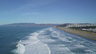 DCSF05_055 - 5K stock footage aerial video Waves crashing near Ocean Beach, Outer Sunset District, California