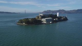 DCSF05_071 - 5K stock footage aerial video Tilt from low flight over San Francisco Bay, revealing Alcatraz, Golden Gate Bridge, California