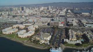 DCSF05_081 - 5K aerial stock footage Flyby waterfront apartment buildings, marinas, KTVU Television/FOX 2 building, Oakland, California
