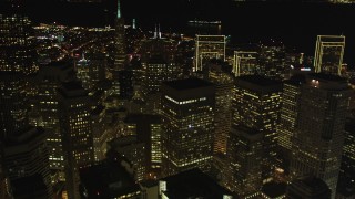 DCSF06_021 - 5K aerial stock footage Tilt from busy streets to reveal skyscrapers and Transamerica Pyramid, Downtown San Francisco, California, night