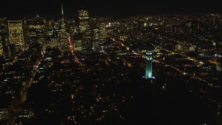 DCSF06_025 - 5K aerial stock footage Flying by Coit Tower with a view of Transamerica Pyramid, San Francisco, California, night