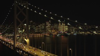 DCSF06_036 - 5K aerial stock footage Focus on Downtown San Francisco skyline and fly over Bay Bridge, California, night 