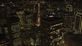 DCSF06_037 - 5K aerial stock footage Tilt from The Embarcadero, reveal Downtown San Francisco skyscrapers, California, night