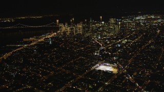 DCSF06_064 - 5K aerial stock footage Fly high altitude by Coit Tower and Downtown San Francisco, California, night