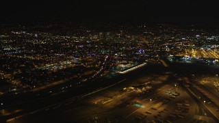 DCSF06_090 - 5K stock footage aerial video Approach Interstate 880 and Downtown Oakland, California, night