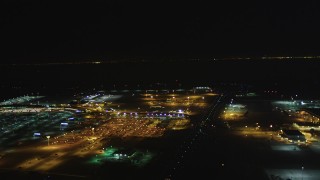 DCSF06_104 - 5K aerial stock footage Flyby Oakland International Airport and the FedEx Terminal, Oakland, California, night