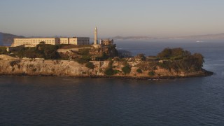 DCSF07_032 - 5K aerial stock footage Low flyby the south end of Alcatraz, San Francisco, California, sunset