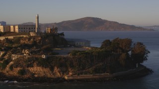 DCSF07_033 - 5K aerial stock footage Low orbit of Alcatraz, San Francisco, California, sunset