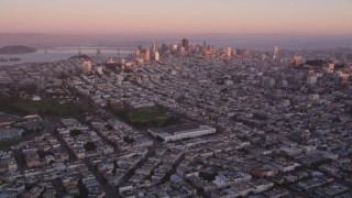 DCSF07_056 - Aerial stock footage of 5K Aerial Video Approach Marina Middle School and baseball fields, downtown in the background, San Francisco, California, twilight