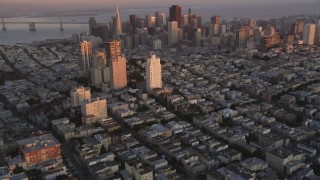 DCSF07_057 - Aerial stock footage of 5K Aerial Video Tilt from Russian Hill apartment buildings to reveal Downtown San Francisco, California, twilight