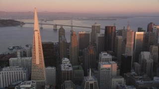 DCSF07_059 - Aerial stock footage of 5K Aerial Video Pan across Transamerica Pyramid and skyscrapers in Downtown San Francisco, California, sunset