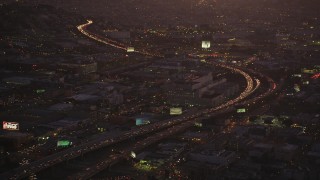 DCSF07_089 - Aerial stock footage of 5K Aerial Video Heavy traffic on Interstate 80 by SFPD and County Jail, South of Market, San Francisco, California, twilight