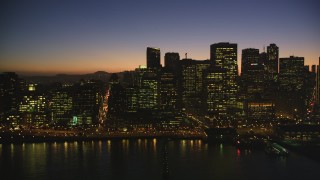 DCSF07_109 - Aerial stock footage of 5K Aerial Video Flyby downtown skyline and reveal the Ferry Building, Downtown San Francisco, California, twilight