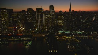 DCSF07_113 - Aerial stock footage of 5K Aerial Video Passing by Downtown San Francisco and Transamerica Pyramid, California, twilight